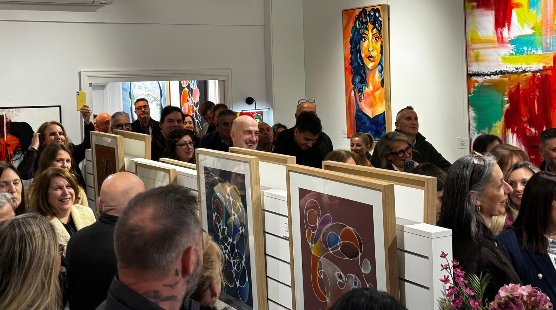 Guests viewing artwork at an exhibition