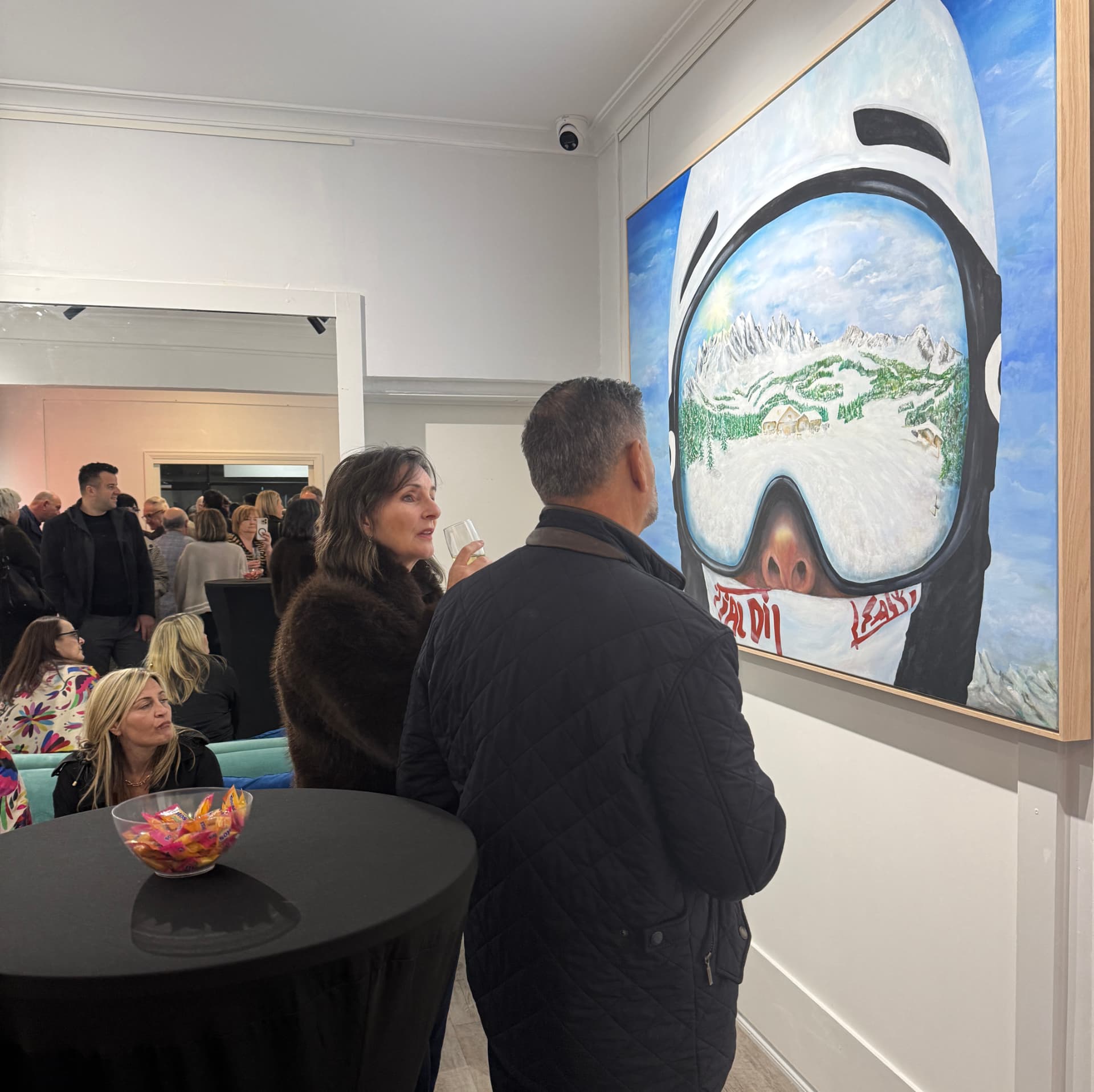 Guests viewing a painting at KIMS SPACE